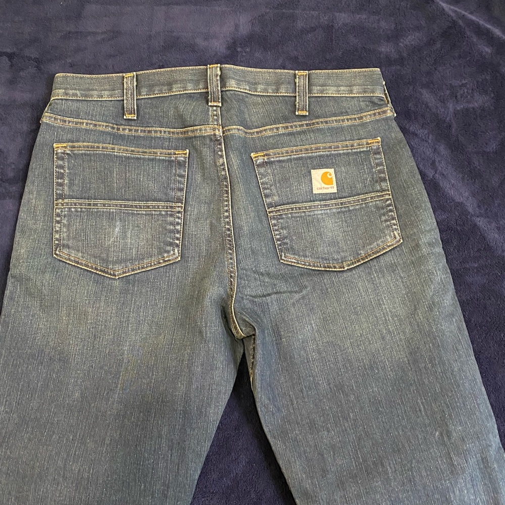 Dark denim carhartt jeans.
